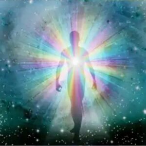 A person is standing in the light of a rainbow.